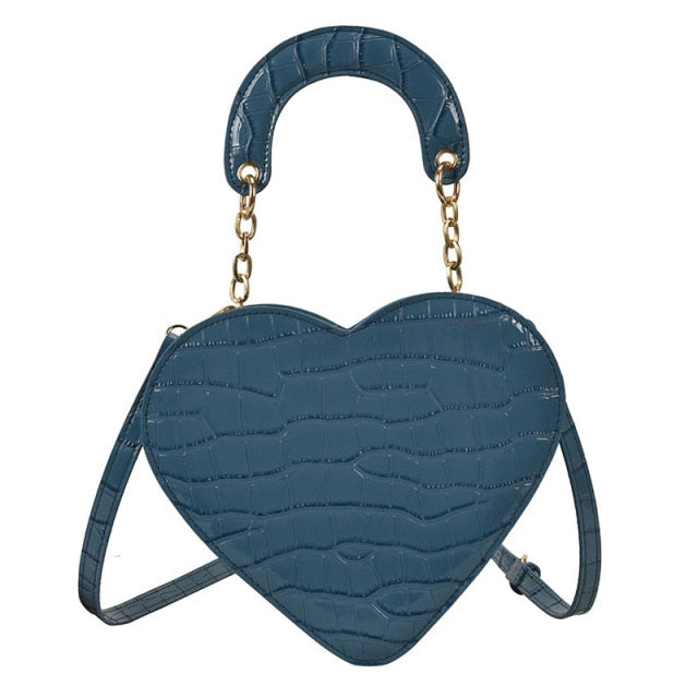Cute Heart Shaped Design Purse This professional-looking yet stylish Cute Heart Shaped Design Purse is perfect for the fashion-forward woman. Thoughtfully designed with quality Pu Leather (Artificial Leather), this chic and eye-catching purse offers a gir