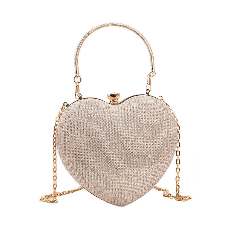 New Fashion Chain Crossbody Explosion Handheld Peach Heart Bag Product information: Color: black, gold, silver Material: Acrylic Luggage trend style: heart shaped bag Bag size: small Popular element: chain Lining texture: polyester Bag shape: heart Cover