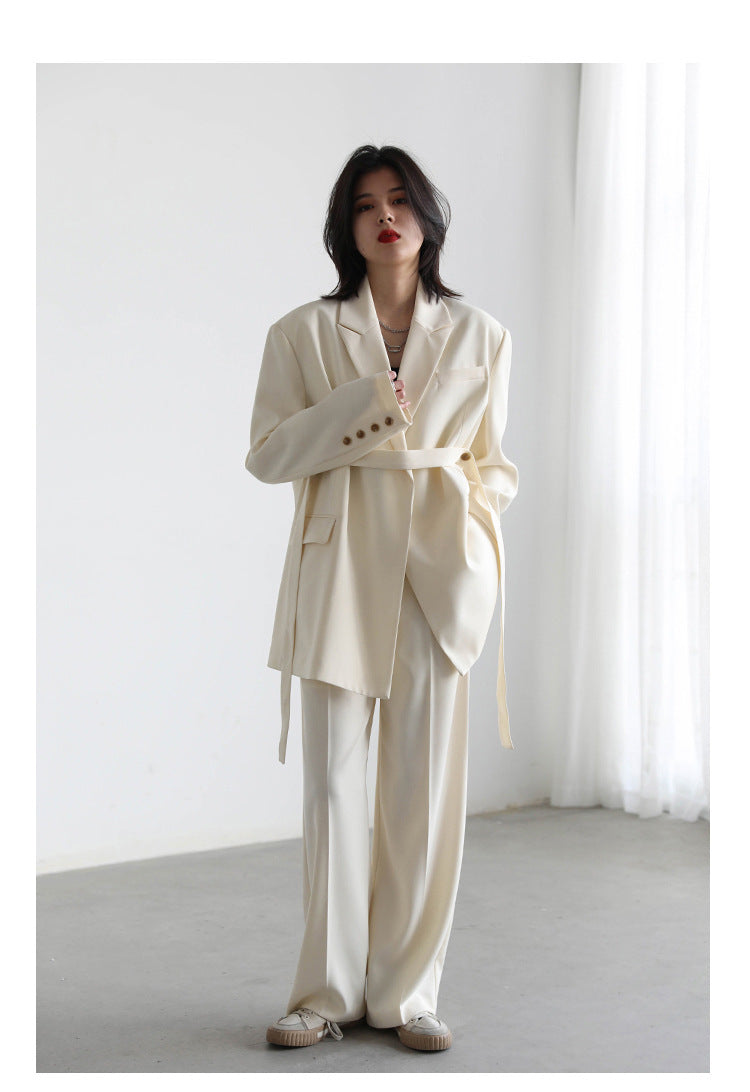 Mid-length Draped Blazer With Flutter StrapsWomen's Suits Product information: Material: Polyester Style: Princess Style Colour: Black jacket, white jacket, black set, white set Size Information: Size: S/M/L/XL Packing list: Jacket*1/ Jacket*1 Trousers*1