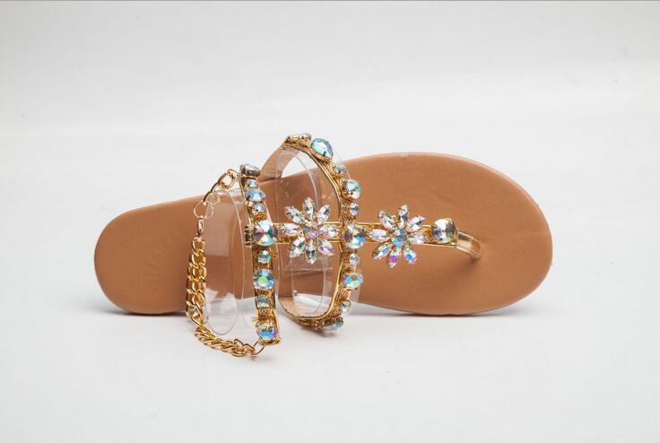 Women's Sandals Introducing our newest line of women's sandals! These beautiful sandals are perfect for any occasion, whether you're dressing up for a night out or just keeping it casual. They feature a stunning rhinestone chain design that is sure to tur