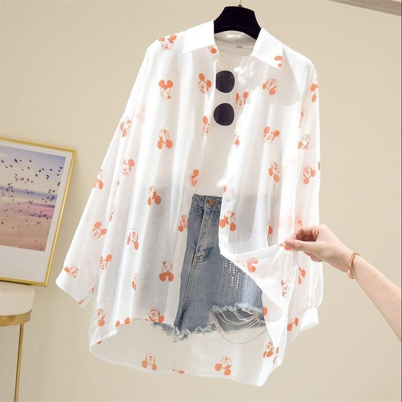 Long Sleeve Blouse Introducing our Long Sleeve Cartoon Blouse – a playful and stylish addition to your wardrobe. This blouse combines comfort and charm with its long sleeves and whimsical cartoon design. Crafted with care, it brings a touch of personality