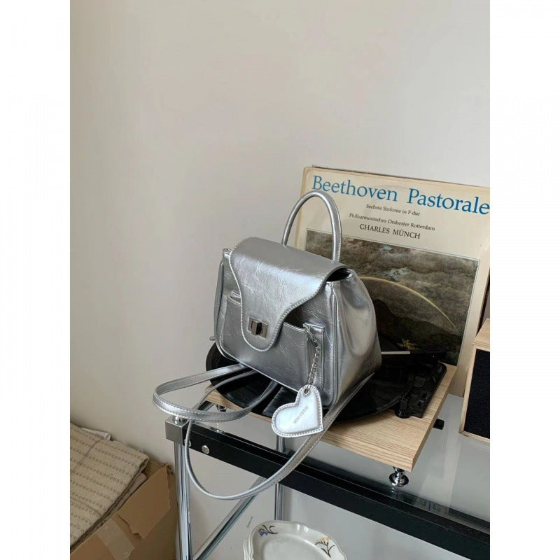 Backpack Silver Special-interest Design Summer Korean Style All-matching Ladies Product information: Pattern: solid color Lining texture: PU Applicable scenario: home storage Color: Black (order to send love pendant), silver (order to send love pendant) A