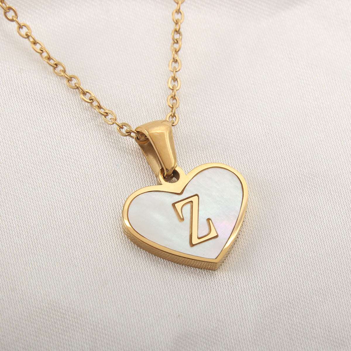 26 Letter Heart-shaped Necklace White Shell Love Clavicle Chain Fashion Personalized Necklace For Women Jewelry Valentine's Day Overview: Unique design, stylish and beautiful. Good material, comfortable wear. A variety of colors, any choice. Product infor