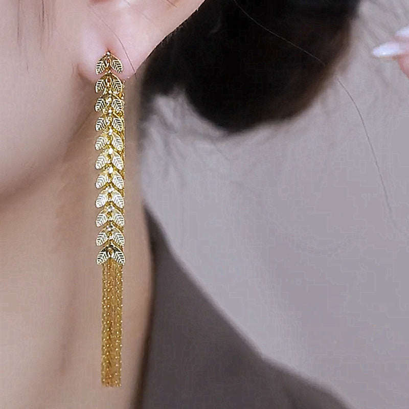 Wheat Long Fringe Earrings Dual-wear Women Product information: Color: Gold Applicable population: Female Material: Copper Shape: Leaves Popular elements: Lines Packing list: Earrings X1 pair Product Image: Wheat Long Fringe Earrings Dual-wear Women Produ