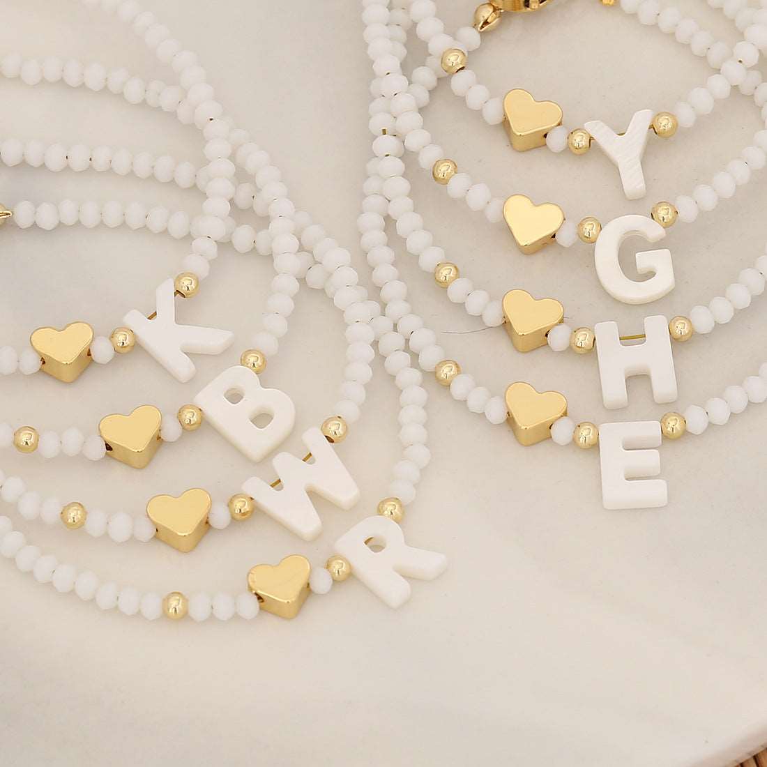 26 Letters White Shell Beaded Bracelet Women Metal Love Design Bracelet Jewelry Product information: Material:Shell Processing: Handmade Style: Women's Packing list: Bracelet*1 Product Image: 26 Letters White Shell Beaded Bracelet Women Metal Love Design