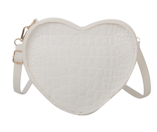 Cute Heart Shaped Design Purse This professional-looking yet stylish Cute Heart Shaped Design Purse is perfect for the fashion-forward woman. Thoughtfully designed with quality Pu Leather (Artificial Leather), this chic and eye-catching purse offers a gir