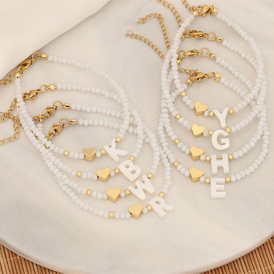 26 Letters White Shell Beaded Bracelet Women Metal Love Design Bracelet Jewelry Product information: Material:Shell Processing: Handmade Style: Women's Packing list: Bracelet*1 Product Image: 26 Letters White Shell Beaded Bracelet Women Metal Love Design