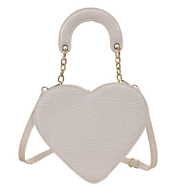 Cute Heart Shaped Design Purse This professional-looking yet stylish Cute Heart Shaped Design Purse is perfect for the fashion-forward woman. Thoughtfully designed with quality Pu Leather (Artificial Leather), this chic and eye-catching purse offers a gir