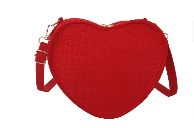 Cute Heart Shaped Design Purse This professional-looking yet stylish Cute Heart Shaped Design Purse is perfect for the fashion-forward woman. Thoughtfully designed with quality Pu Leather (Artificial Leather), this chic and eye-catching purse offers a gir