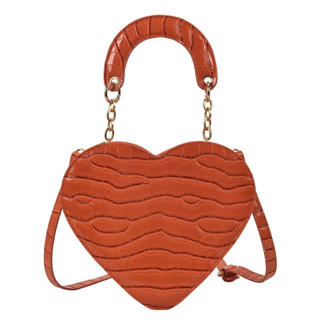 Cute Heart Shaped Design Purse This professional-looking yet stylish Cute Heart Shaped Design Purse is perfect for the fashion-forward woman. Thoughtfully designed with quality Pu Leather (Artificial Leather), this chic and eye-catching purse offers a gir