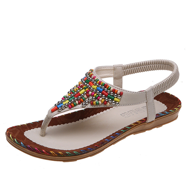Beach Flip Toe Beaded Flat Sandals Product information: Pattern: solid color Lining material: imitation leather Color: beige, brown Upper height: low top Size: 36, 37, 38, 39, 40, 41, 42, 43 Sole craft: viscose shoes Sole material: rubber Popular elements
