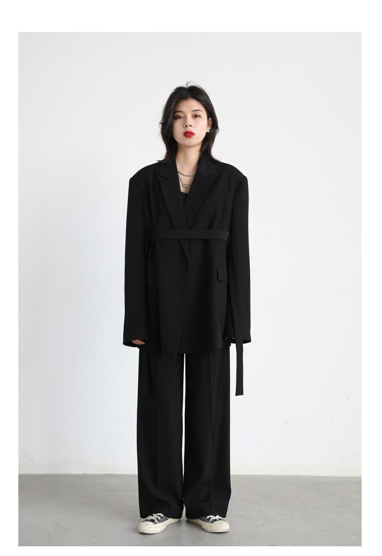 Mid-length Draped Blazer With Flutter StrapsWomen's Suits Product information: Material: Polyester Style: Princess Style Colour: Black jacket, white jacket, black set, white set Size Information: Size: S/M/L/XL Packing list: Jacket*1/ Jacket*1 Trousers*1