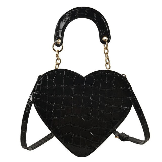 Cute Heart Shaped Design Purse This professional-looking yet stylish Cute Heart Shaped Design Purse is perfect for the fashion-forward woman. Thoughtfully designed with quality Pu Leather (Artificial Leather), this chic and eye-catching purse offers a gir