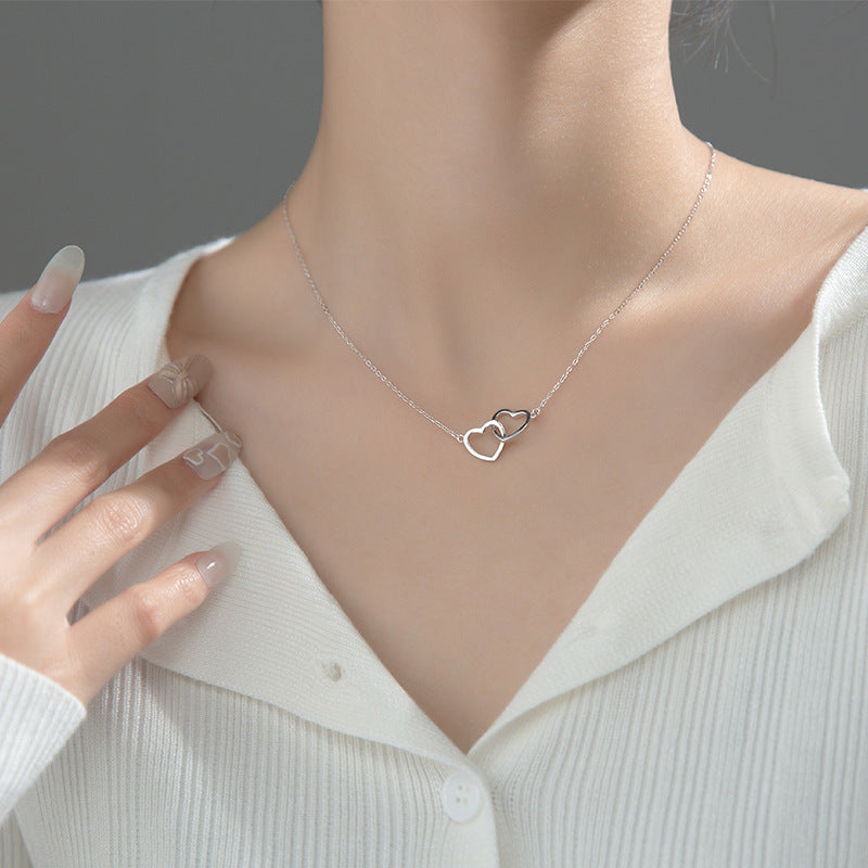 Double Heart Interlocking Titanium Steel Necklace Jewelry Overview: 100% new design and high quality Must-have for fashion women Have a beautiful appearance Specifications: Material: titanium steel Treatment process: electroplating Type: necklace Style: W