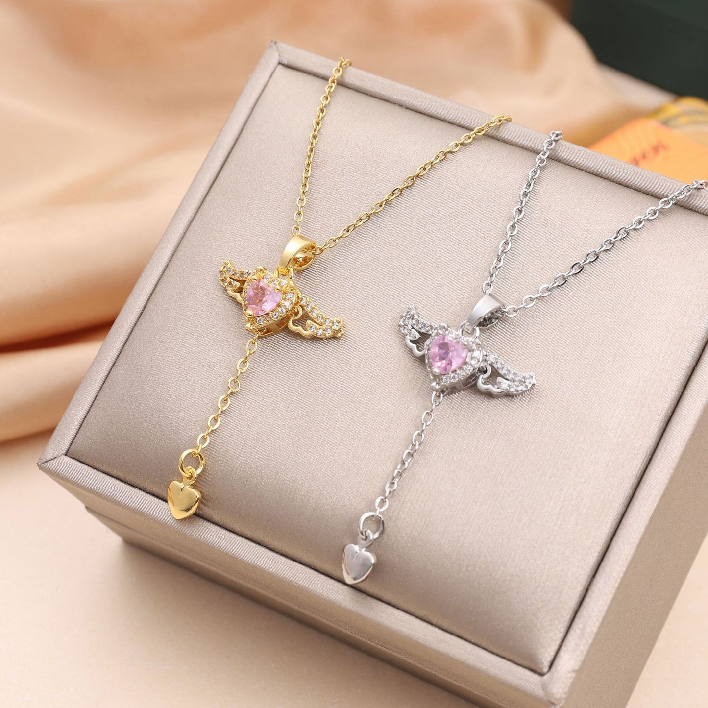 Cupid Heart Angel Wings Tassel Necklace Clavicle Chain Product information: Treatment Process: Electroplating Color: BT007 wing fly silver Cupid, BT025 wing fly gold Cupid Chain style: O-shaped necklace Material: titanium steel Shape: heart shape Circumfe