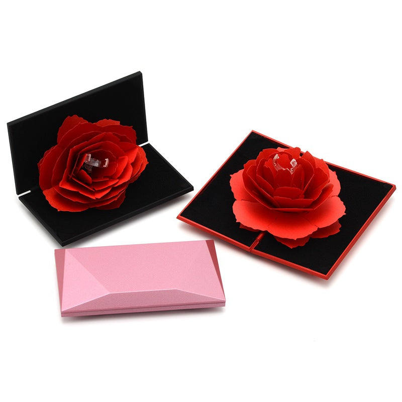 3D Love Box Heart-shaped Rose Flower Rotating Ring Box Valentines Day Gift It's just a box! You need buy a ring if you want more! Overview: Unique design, stylish and beautiful. Good material to use. A variety of colors, more choice. Product Details: Mate