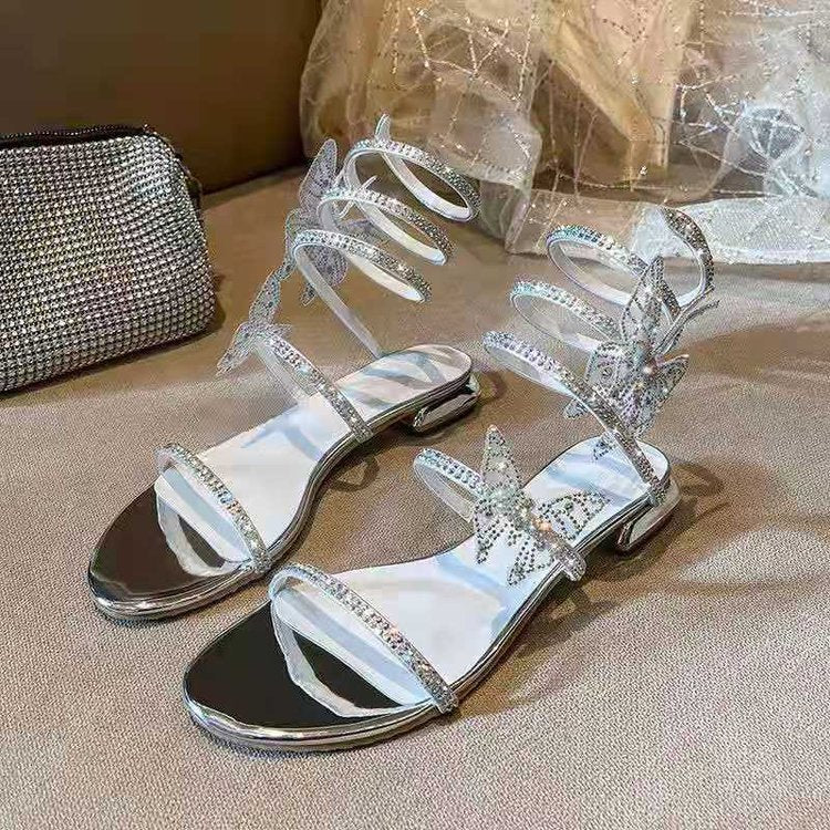 Rhinestone Snakelike Winding Sandals Women's Summer Low Heel New Flat Product information: Toe holder shape: round head Color: Silver Shoe Upper material: PU Size: 35,36,37,38,39,40 Applicable age: Adult Popular elements: waterproof platform Style: Korean