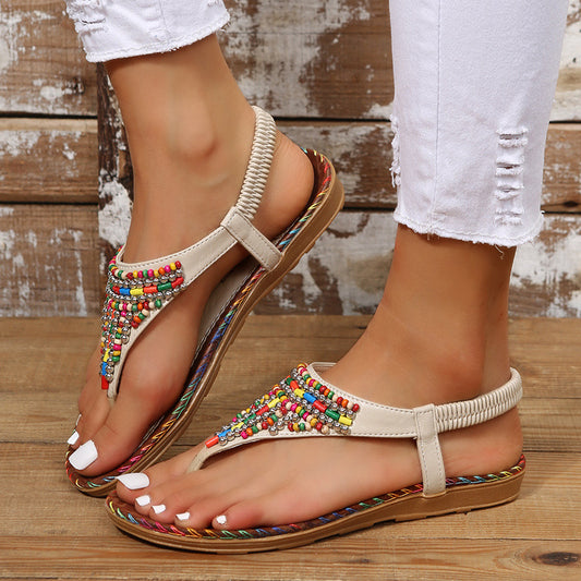 Beach Flip Toe Beaded Flat Sandals Product information: Pattern: solid color Lining material: imitation leather Color: beige, brown Upper height: low top Size: 36, 37, 38, 39, 40, 41, 42, 43 Sole craft: viscose shoes Sole material: rubber Popular elements