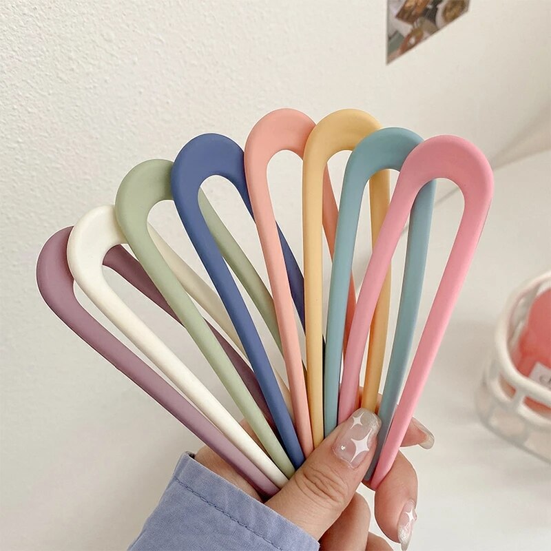 Fashion Candy Color Hair Sticks for Women Elevate your hair game with our Fashion Candy Color Hair Sticks for Women. These Simple Hair Clip Pins come in a variety of vibrant candy colors, adding a playful touch to your hairstyles. Crafted with a minimalis