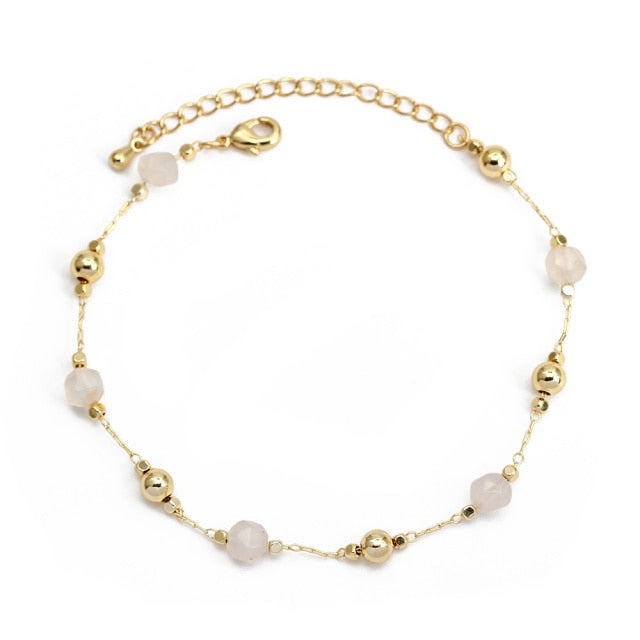 Charm Bracelet Introducing the Charm Bracelet! This beautiful bracelet is made of high quality materials, including copper, pearls, and natural stones. It's the perfect accessory to add a touch of elegance to any outfit. The Charm Bracelet is also a great