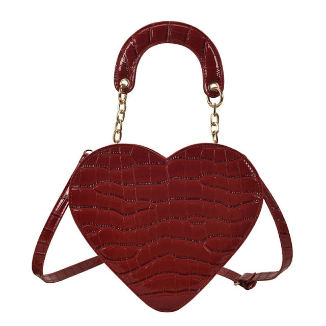 Cute Heart Shaped Design Purse This professional-looking yet stylish Cute Heart Shaped Design Purse is perfect for the fashion-forward woman. Thoughtfully designed with quality Pu Leather (Artificial Leather), this chic and eye-catching purse offers a gir