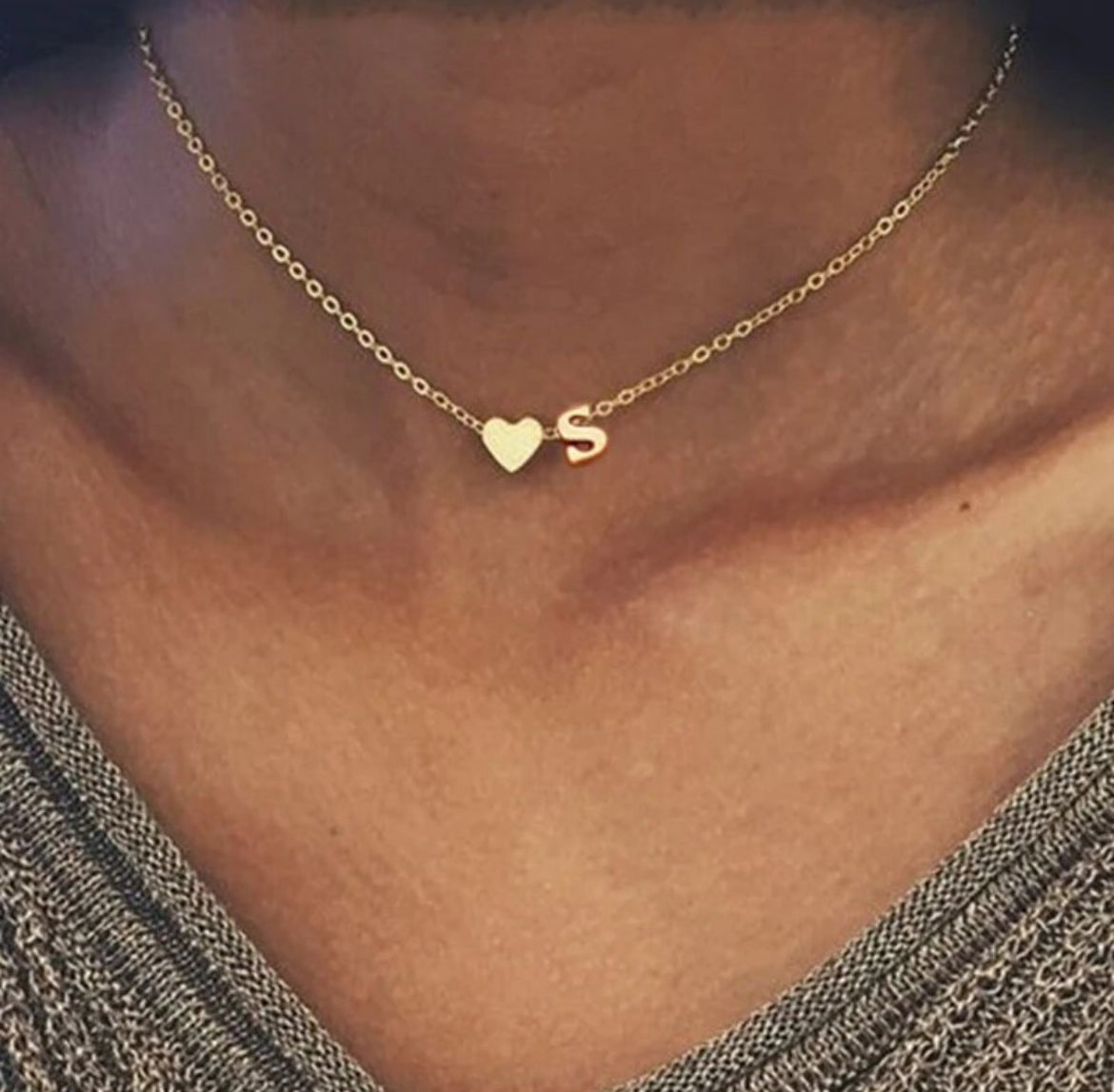 Heart Letter Pendant Cherish your special moments with our Heart Letter Pendant. This exquisite piece of jewelry is a symbol of love and personalization. Crafted with care, it allows you to wear your loved one's initial close to your heart, creating a mea
