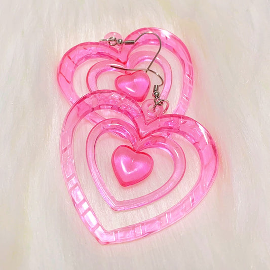 Pink Hollowout Heart Earrings Introducing our Y2K Earrings Pink Hollowout Heart Earrings, the perfect accessory to add a touch of nostalgia and vibrant style to your look. Inspired by the Y2K era, these earrings embody the essence of Korean fashion, kawai