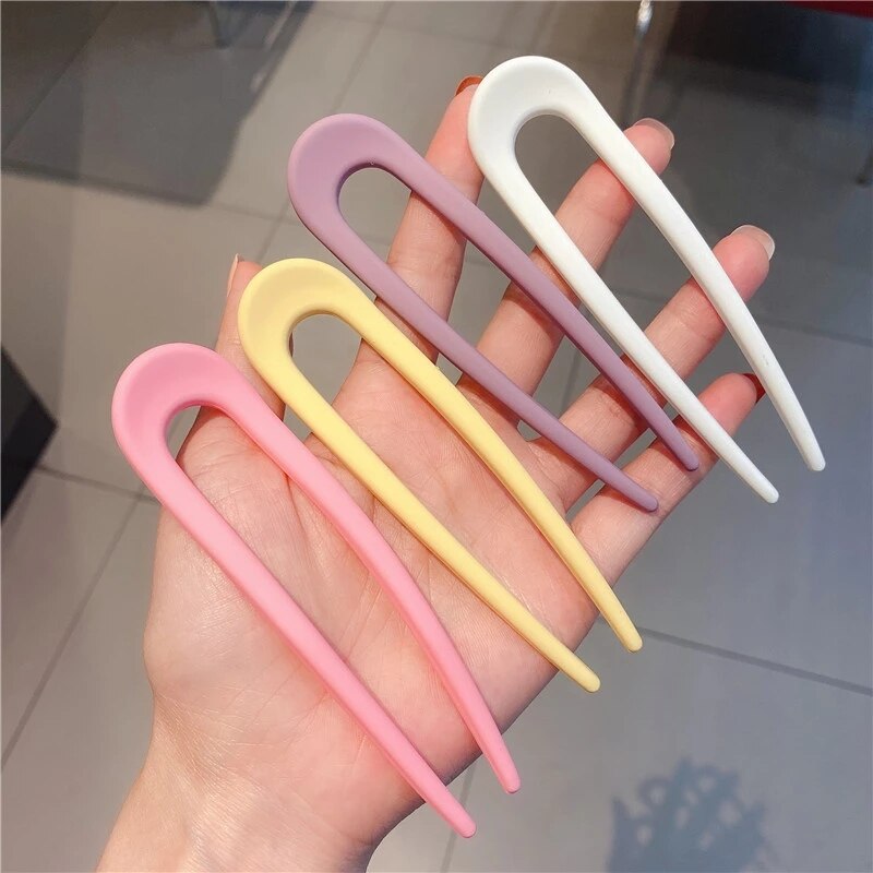 Fashion Candy Color Hair Sticks for Women Elevate your hair game with our Fashion Candy Color Hair Sticks for Women. These Simple Hair Clip Pins come in a variety of vibrant candy colors, adding a playful touch to your hairstyles. Crafted with a minimalis