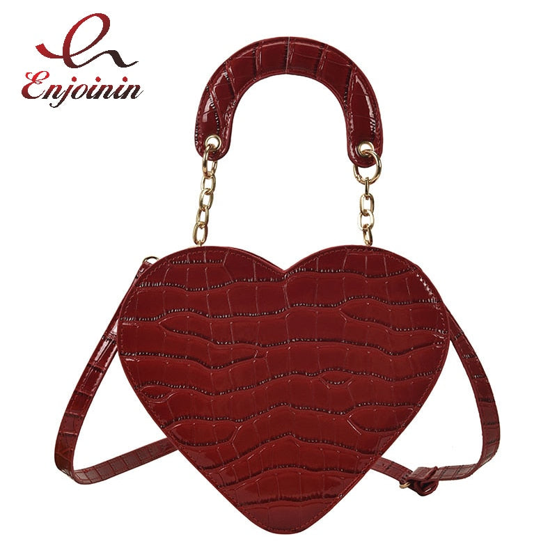 Cute Heart Shaped Design Purse This professional-looking yet stylish Cute Heart Shaped Design Purse is perfect for the fashion-forward woman. Thoughtfully designed with quality Pu Leather (Artificial Leather), this chic and eye-catching purse offers a gir
