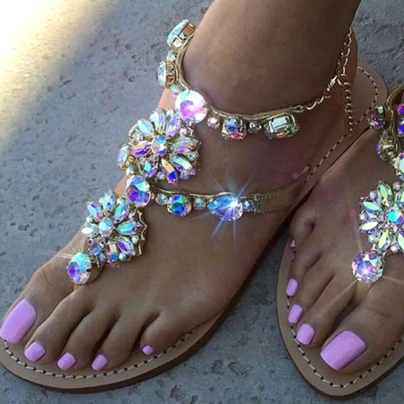 Women's Sandals Introducing our newest line of women's sandals! These beautiful sandals are perfect for any occasion, whether you're dressing up for a night out or just keeping it casual. They feature a stunning rhinestone chain design that is sure to tur