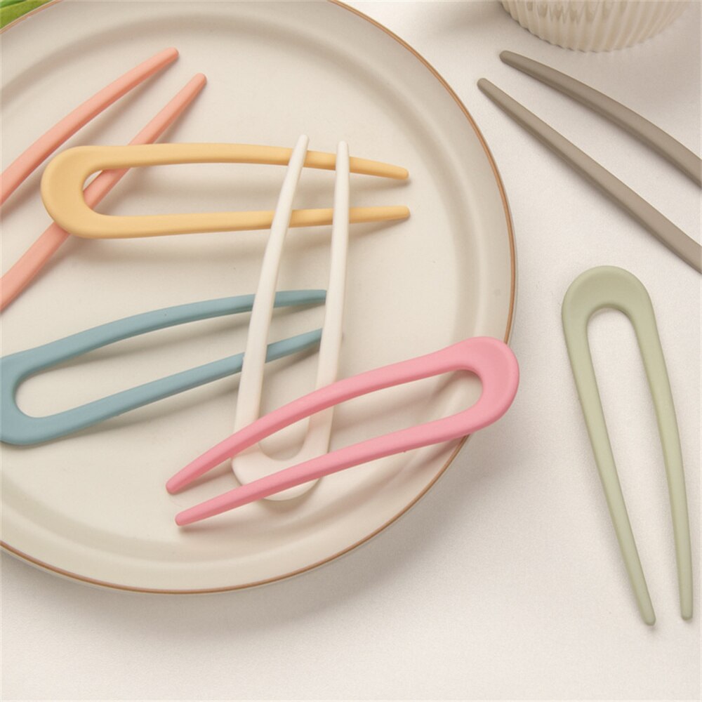 Fashion Candy Color Hair Sticks for Women Elevate your hair game with our Fashion Candy Color Hair Sticks for Women. These Simple Hair Clip Pins come in a variety of vibrant candy colors, adding a playful touch to your hairstyles. Crafted with a minimalis